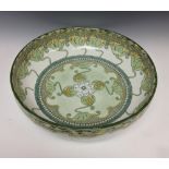 A Doulton Burslem Kelmscott pattern circular bowl, decorated in the Art Nouveau taste with sinuous