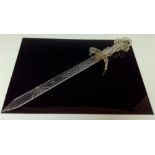 A 19th century novelty Continental glass short sword, the blade geometrically cut, the hilt with