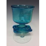 A Mdina blue and yellow glass chalice with horizontal trailed stem, signed Mdina Glass, 19.5cm