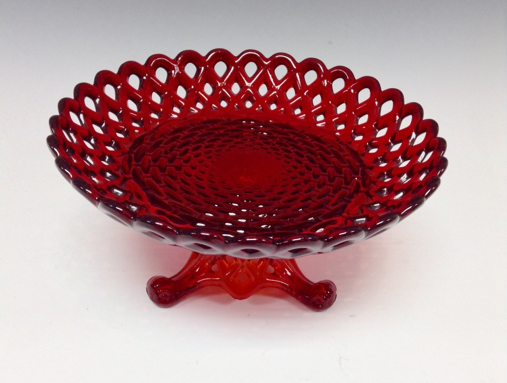 A Sowerby pressed glass rubine plate and stand, decorated with latticework and basket weave in