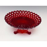 A Sowerby pressed glass rubine plate and stand, decorated with latticework and basket weave in