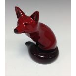 A Royal Doulton flambe fox, seated, 11cm high,