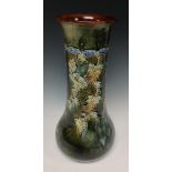 A Royal Doulton inverted baluster vase, designed Winnie Bowstead, mottled green,