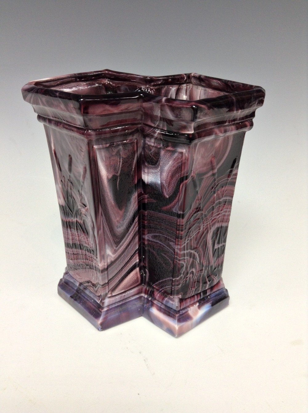 A pressed glass purple malachite two-section vase, possibly by Davidson, decorated in relief with