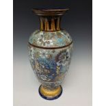 A Doulton Lambeth pedestal ovoid vase, incised with oval mazes and flowers picked out in brown,