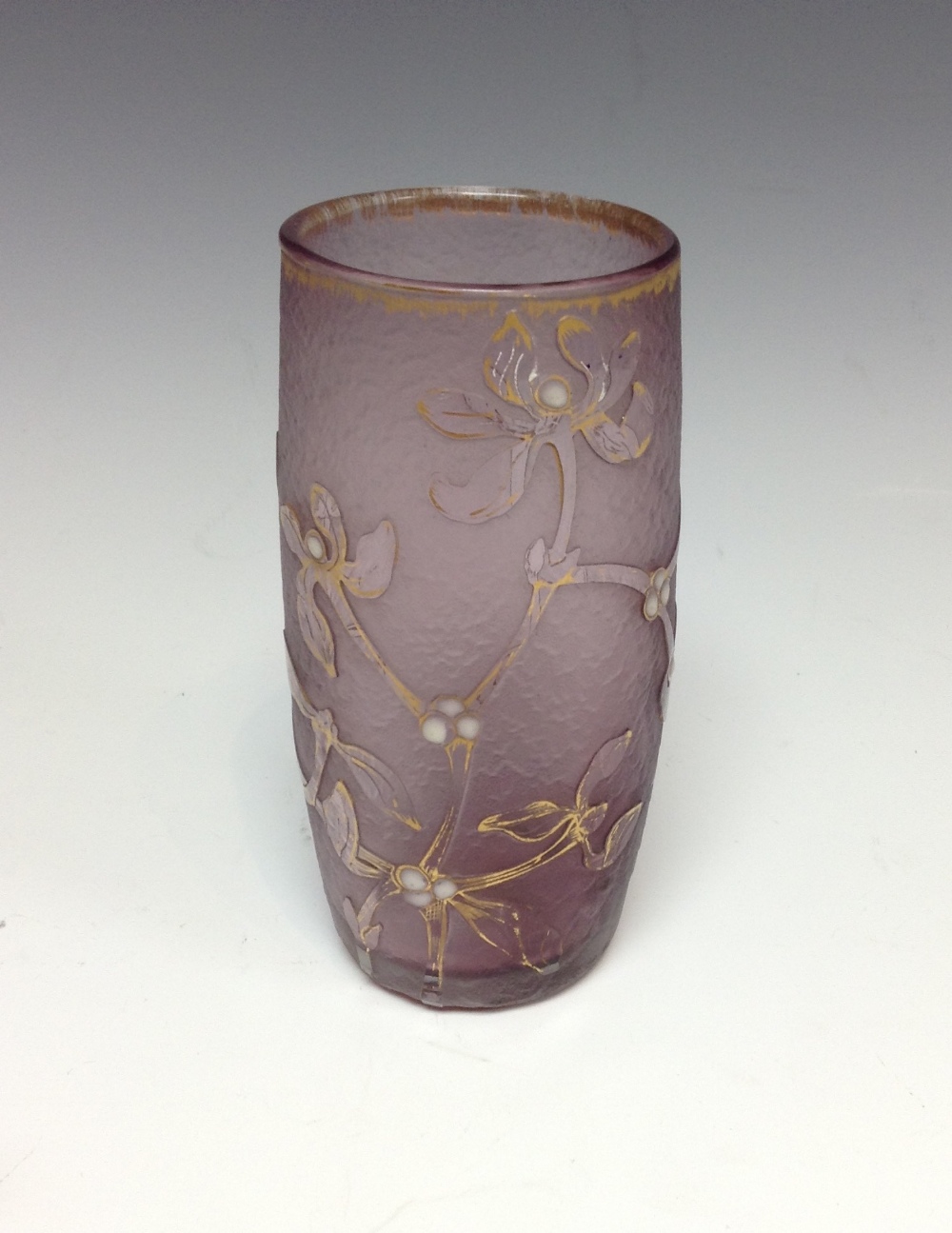 A Daum mauve cyclindrical cameo glass vase, decorated with enamel mistletoe and picked out in gilt,