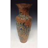 A Royal Doulton slender baluster vase, incised with grey glazed scrolls,