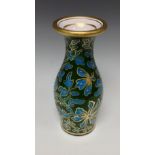 A Bohemian blue glass baluster vase, cased with green, picked out with gilt foliage,