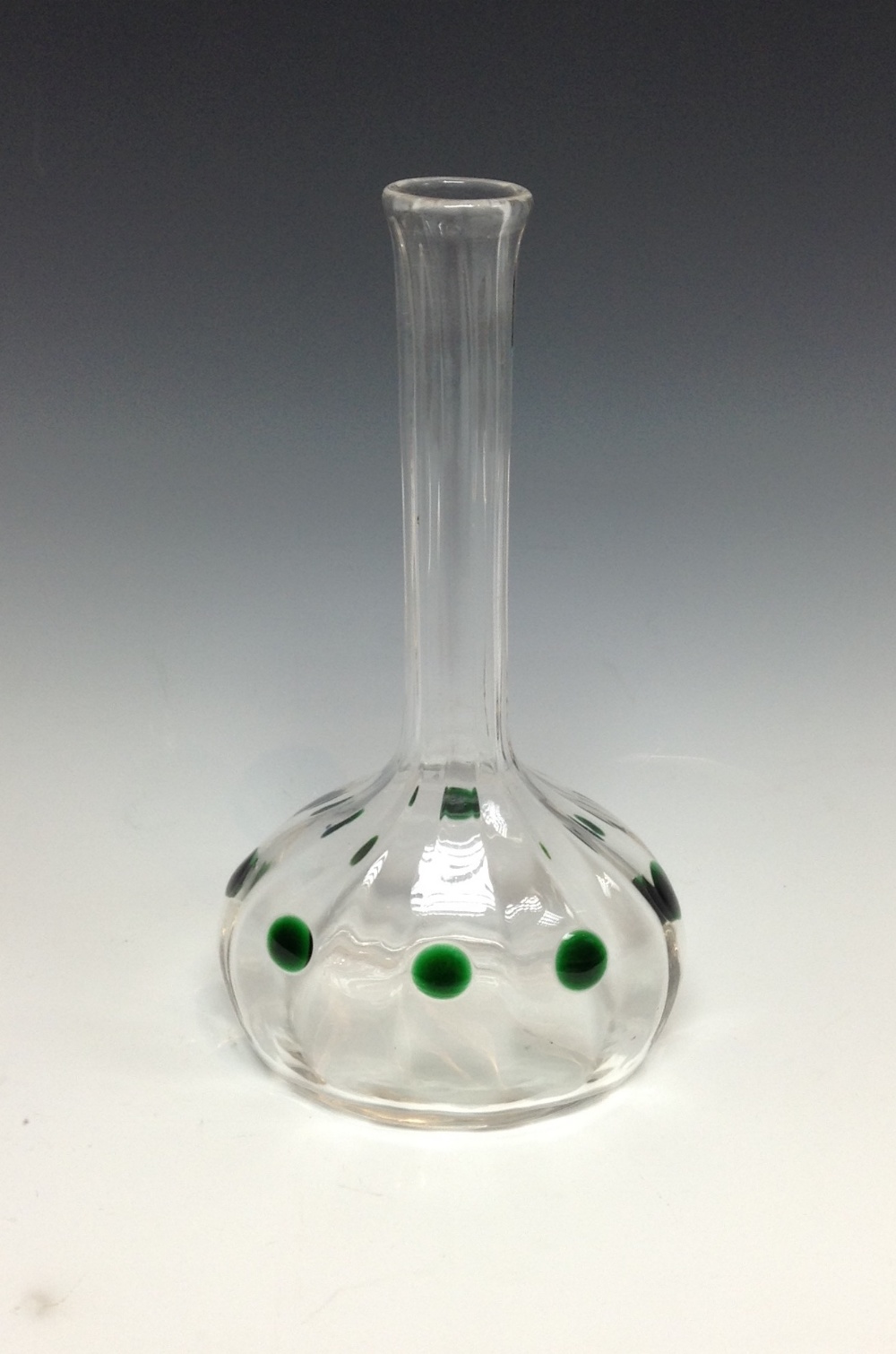 A late 19th/early 20th century Austrian clear glass vase with applied green dots, slender elongated