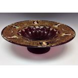 A Bohemian ruby glass pedestal centre bowl, fluted dish, the deep sides with six oval cartouches,