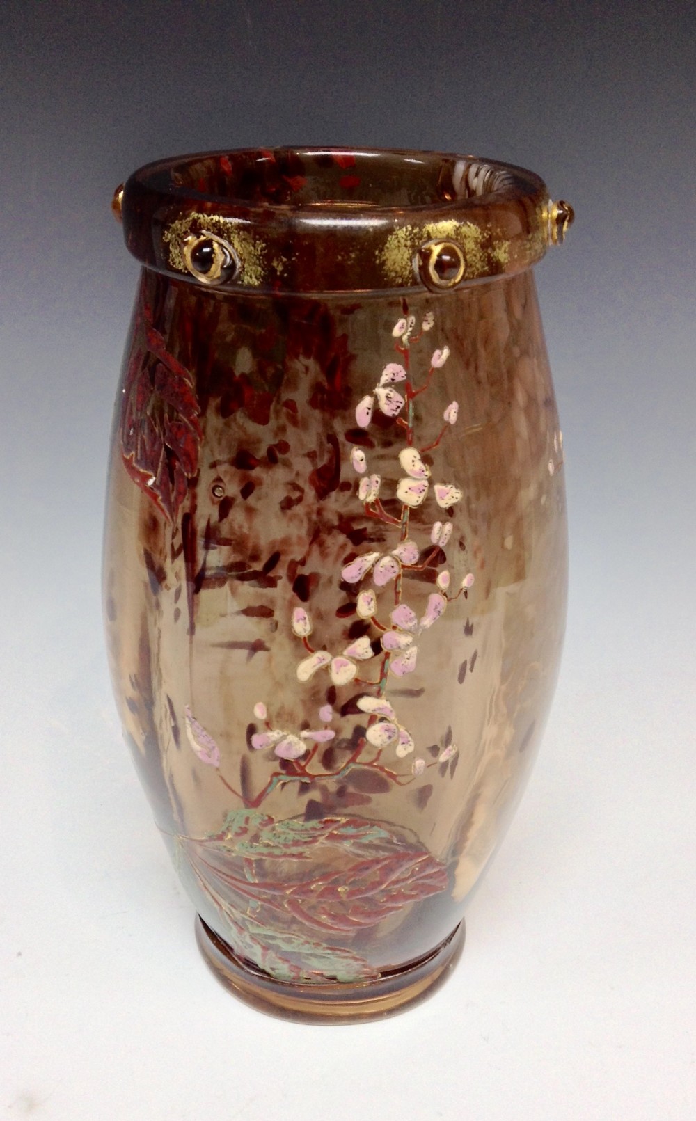 A circular Gallè smoky quartz glass vase, enamelled with horse chestnut in blossom, flecked with