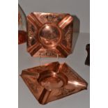A pair of WMF Art Nouveau copper ashtrays, decorated with stylised flowers, ostrich mark verso,