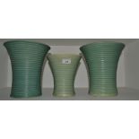A near garniture of Lovatts flared trumpet vases, the mint green ground with horizontal banding,