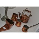 A graduated set of three copper cider measures,