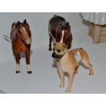 A Beswick model of a horse, matt brown glaze; another, similar,