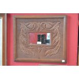 Arts and Crafts carved oak mirror
