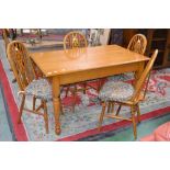 An Old Charm oak dining table, single drawer to one end,