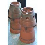 A pair of cone shaped chimney pots