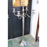 A modern floor standing four branch five light candelabra