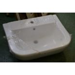 A white porcelain rounded rectangular sink,