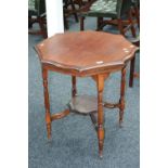 An Edwardian mahogany two tier shaped occasional table