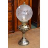 Brass oil lamp with etched glass globe