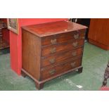 A mahogany bachelor's chest, brushing slide over four graduated drawers, brass batwing escutcheons,