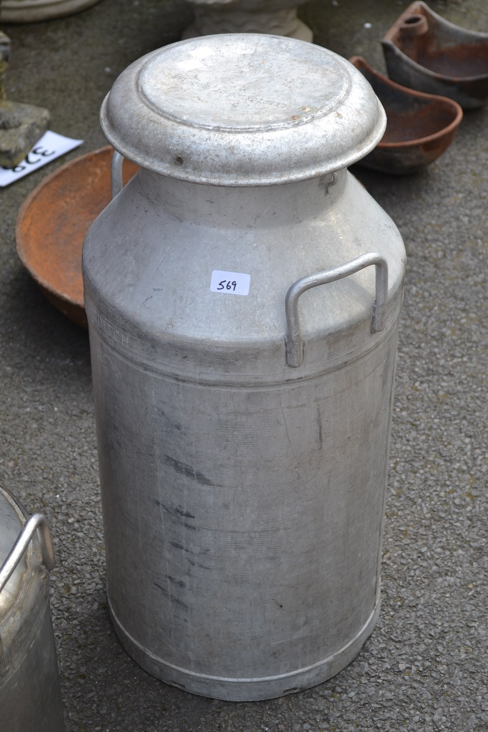 An Ilkeston COOP LTD aluminium milk churn