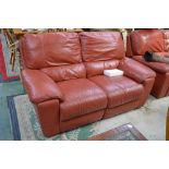 An electric reclining two seat sofa