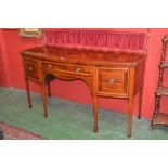 A George III mahogany bow fronted sideboard, brass curtained gallery,