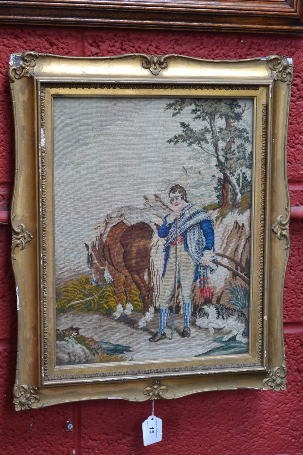 A Victorian Berlin woolwork picture, a farmer and his companions, he wistfully stands by his horse,