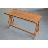 A mahogany coffee table, rectangular top, reeded lyre shaped supports.