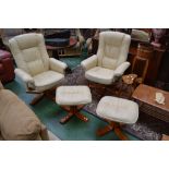 A pair of modern leather reclining armchairs,