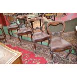 A set of four Victorian mahogany balloon back dining chairs, carved horizontal splat,