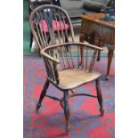 An elm and ash Windsor chair hooped spindled back with pierced splat, crinoline stretcher,