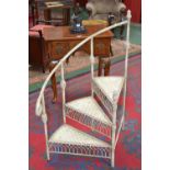 An Edwardian spiral library step ladder, tubular reeded frame,