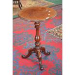 A Victorian mahogany tripod table, circular top, turned baluster fruitwood column, cabriole legs,