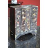 A Japanese black lacquer inlaid table cabinet,