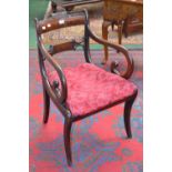 A George III open arm chair, curved cresting top rail, scrolling arms,