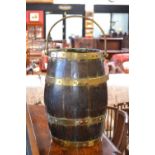 An oak barrel shaped coal bucket and a brass jam pan