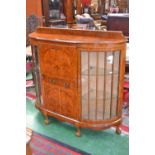 A burr walnut breakfront bureau/cabinet c.