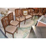 An Edwardian mahogany inlaid seven piece salon suite