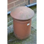 A terracotta dome topped chimney pot