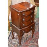 A small George III style mahogany serpentine fronted chest of drawers