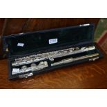 A silver plated practice flute by J.