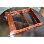 A modern mahogany wall hanging shelf, three tiers,