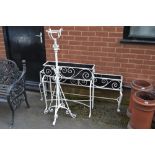 Two wrought iron planters;