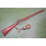 A reproduction tower percussion cap wall hanging musket;