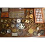 Horology - clock and watch parts including a box of assorted brass bushes for clocks and regulators;