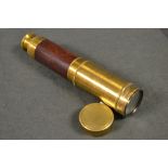 An early 20th century brass and mahogany three draw telescope